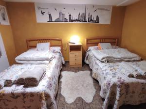 A bed or beds in a room at Casa Terzia a 10 min de Logroño