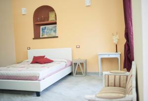 เตียงในห้องที่ Agriturismo Dipinture