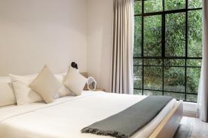 A bed or beds in a room at Nido Condesa by RentinBA