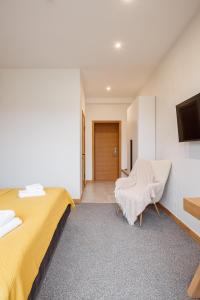 Postel nebo postele na pokoji v ubytování Yo Hotel