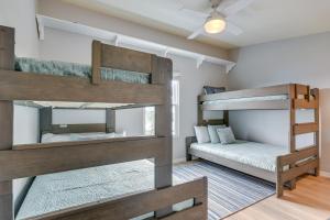 a room with two bunk beds in a house at Luxury Galveston Retreat - Walk to Pirates Beach! in Galveston