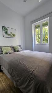 Posteľ alebo postele v izbe v ubytovaní Malaga Home