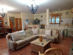 a living room with two couches and a table at Cortijo Paulenca in Almería