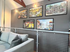 a living room with four pictures on the wall at Stylish~Tasteful~2Bed~2Bath~Central~Townhouse in Penzance