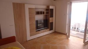 Kuchyň nebo kuchyňský kout v ubytování Apartments Tomi