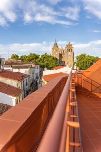a view from the roof of a building with a train at Guest House - Palácio Diana in Évora