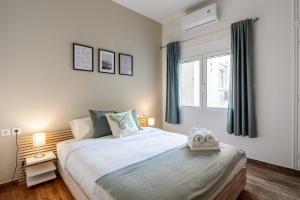 Llit o llits en una habitació de Theia 1-Bedroom Apartment in Athens