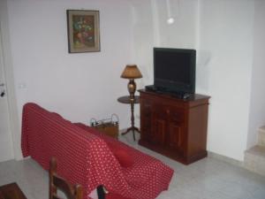 TV a/nebo společenská místnost v ubytování B&B La Taverna