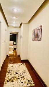 an empty hallway with a rug on the floor at Formidable of Cairo in Cairo