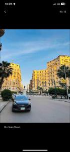 a car parked in a parking lot in front of a building at Formidable of Cairo in Cairo