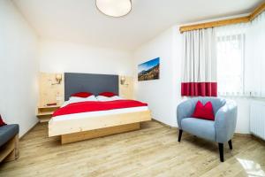 Rúm í herbergi á Pension Kreuzer