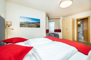 Rúm í herbergi á Pension Kreuzer