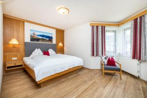 Rúm í herbergi á Pension Kreuzer