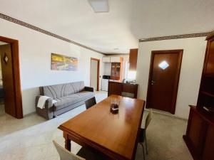 a living room with a table and a couch at Cocò Marì in Naples