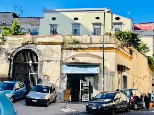 a group of cars parked in front of a building at Cocò Marì in Naples