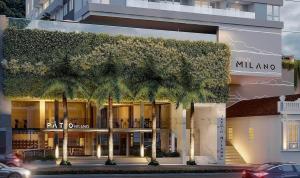 una tienda con palmeras frente a un edificio en Estúdio Estiloso no Pátio Milano, en Florianópolis