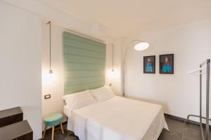 Ένα ή περισσότερα κρεβάτια σε δωμάτιο στο Palazzo Firrao, Napoli