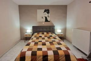 a bedroom with a bed and two end tables at Little village Trikala 