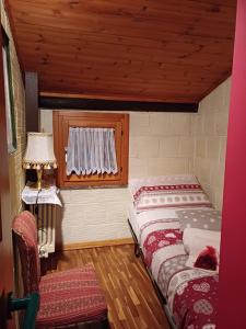 Giường trong phòng chung tại CASA VACANZE CA' MORESCHI