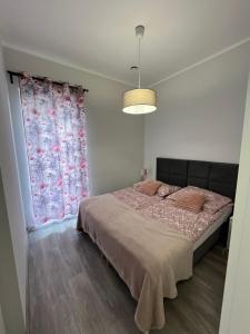 Postel nebo postele na pokoji v ubytování Apartamenty Na wzgórzu