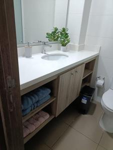 a bathroom with a sink and a mirror at Terrazas de Cochoa in Viña del Mar