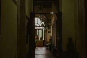 an alley way with a hallway with a window at Hotel Posada San Agustin in Durango