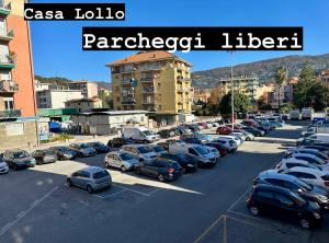 a parking lot full of cars in a city at Casa Lollo in Chiavari