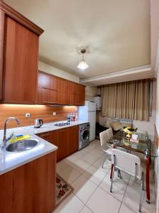 a kitchen with a sink and a table in it at Apartment in the centre of Yerevan for rent in Yerevan