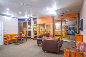 a living room with a couch and chairs and a table at Cozy Brian Head Condo Walk to Navajo Express Lift in Brian Head