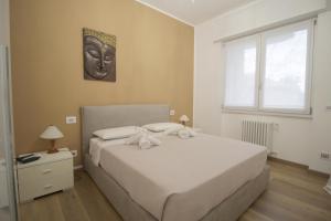a bedroom with a large bed and a window at Villa Giulini Rho in Rho