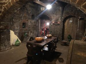 a room with a table with pumpkins on it at Antica residenza La Rocca in Montefiascone