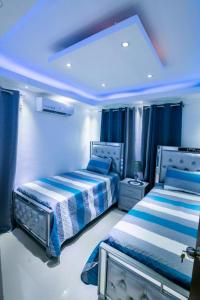 Postel nebo postele na pokoji v ubytování Breezes by TECASA