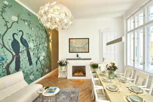 a living room with a table and a fireplace at Fully equipped apartment Budapest, Hungary in Budapest