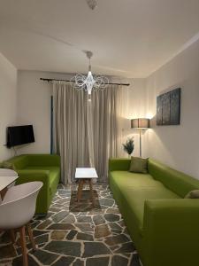 TV a/nebo společenská místnost v ubytování Tasmaria Aparthotel