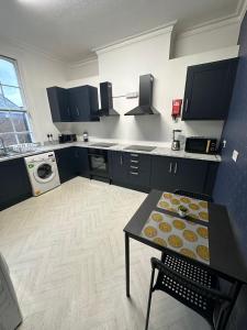 a kitchen with a table with cupcakes on it at 10 Minutes to Central London Vaux in London
