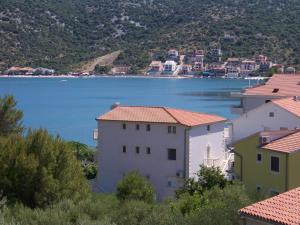 a group of buildings with a view of a body of water at Apartments Zdenka in Marina