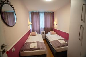 Posteľ alebo postele v izbe v ubytovaní Apartament Hotel Grzybowska 9