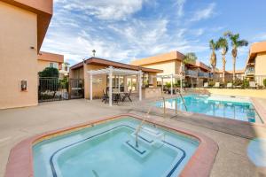 a swimming pool in the courtyard of a villa at Private Patio, Community Perks Palm Springs Condo in Palm Springs