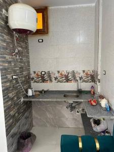 a bathroom with a sink and a counter top at Nubian Bride guest house in Aswan