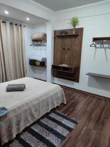 Aconchegante Apartamento em Ouro Preto客房内的一张或多张床位