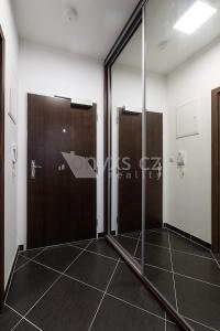 a bathroom with a shower and a glass door at Praha Letňany 168 Free garage parking in Prague