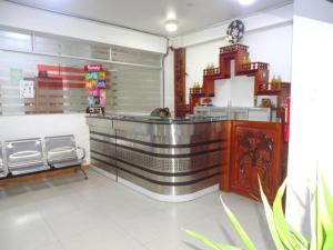 a fast food restaurant with a counter in a store at Hotel LUCHINE in Pucallpa