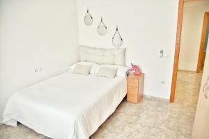 Postel nebo postele na pokoji v ubytování Apartamento Playa Xilxes