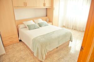Postel nebo postele na pokoji v ubytování Apartamento Playa Xilxes