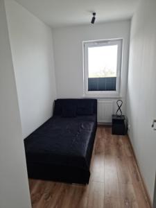 Säng eller sängar i ett rum på Perłowy Apartament