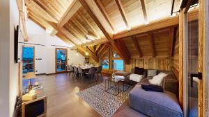 a living room with a couch and a table at Chalet Sétaz in Valloire