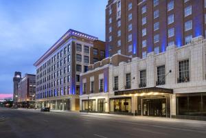 an empty street in front of tall buildings at The Warrior Hotel, Autograph Collection in Sioux City