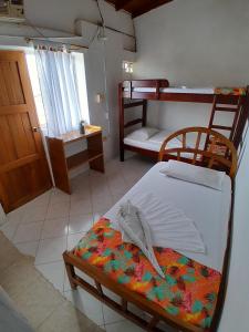 Двухъярусная кровать или двухъярусные кровати в номере Hotel Princesa Katia