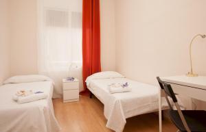 Ένα ή περισσότερα κρεβάτια σε δωμάτιο στο Apartment Mirland Barcelona