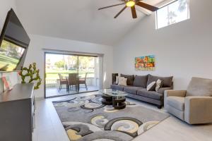 a living room with a couch and a table at Cathedral City Gem 6 Mi to Downtown Palm Springs! in Cathedral City